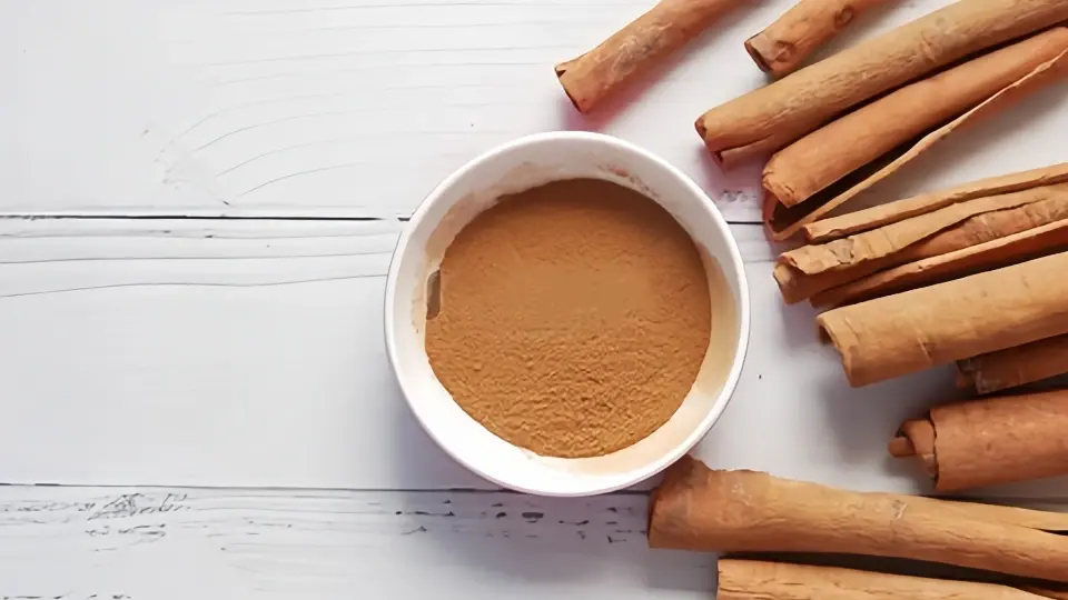 An image of cinnamon sticks and cinnamon powder An image of cinnamon sticks and cinnamon powder